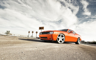 Bright orange sports car tiltshift - the side of the road free wallpaper