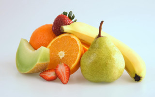 Fruit pile bananas oranges strawberries - arcimboldo free wallpaper