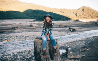 Woman tree stump river mountains - claire hummel free wallpaper