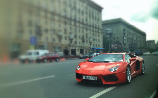 Red sports car city street - f 8 aperture free wallpaper