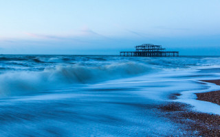 Pier waves beach blue sky - david annand free wallpaper