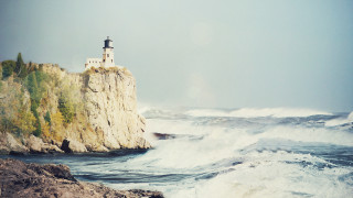 Lighthouse cliff waves beach ocean - wave free wallpaper