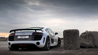 White sports car rock formation - andrew law free wallpaper
