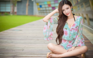 Woman floral dress sitting barefoot - a wooden floor free wallpaper