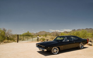 Black car desert mountains gate - a desert area free wallpaper