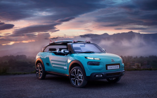 Blue car gravel road mountains - cloudy free wallpaper