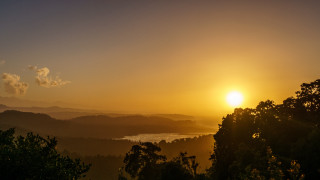 Sunset lake mountains trees clouds - a sunset over a lake free wallpaper