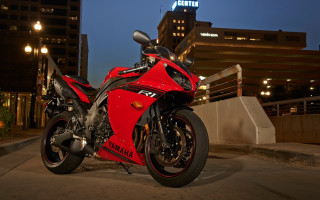 Red motorcycle cityscape night lit - a tall building free wallpaper