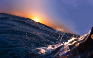 Sunset ocean wave blurry background 2 - photorealistic imagery free wallpaper for desktop