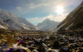 Mountain snowy landscape city light - a mountain range in the background free wallpaper