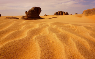 Desert rock formation cloudy sky 6 - a rock formation in the middle of it free wallpaper