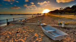Beach sunset boat ocean sky - sandy free wallpaper