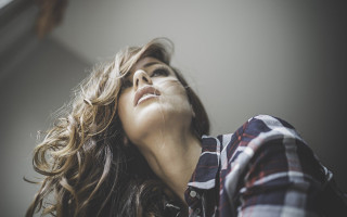Woman blowing hair eyes closed - the wind free wallpaper for desktop