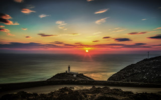 Lighthouse cliff ocean sunset colorful - a colorful sky free wallpaper