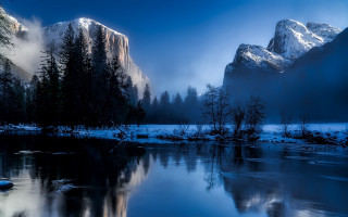 Mountain range reflection lake foggy - a still lake free wallpaper