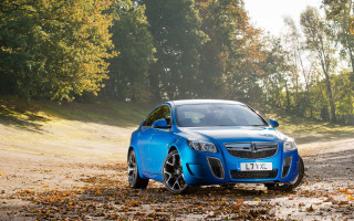 Blue car dirtroad trees hill - a blue car free wallpaper