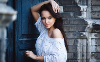 Woman white top brick wall - a woman leaning against a wall free wallpaper