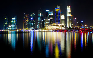 City skyline bridge river night 74 - the water and a bridge in the foreground free wallpaper