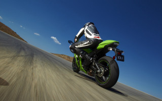 Motorcycle rider road cloud hill - a person riding free wallpaper