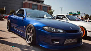 Blue car white car parking - edi rama free wallpaper
