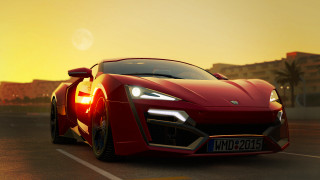 Red sports car city sunset 3 - a yellow sky free wallpaper