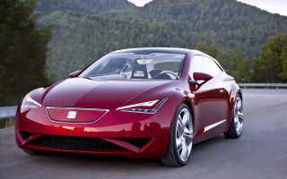 Red sports car road forest 10 - a mountain range in the background free wallpaper