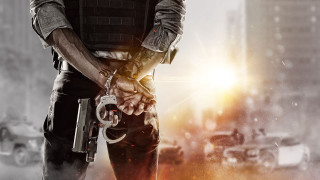 Man holding gun street city - his hand free wallpaper
