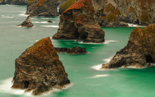 Rock cliff bird water impressionist - a group of rocks free wallpaper