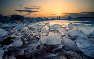 Sunset rocky beach ice waves - the rock and the water free wallpaper