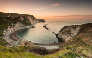 Beach cliff water sunset nature - a view of a beach free wallpaper