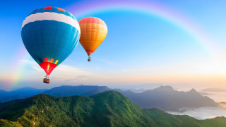Hot air balloons mountains rainbow - over a mountain range free wallpaper
