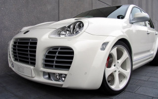 White sports car building night - the front of it free wallpaper