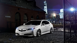White car city night fence - a city skyline in the background free wallpaper