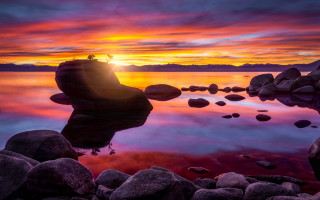 Sunset lake rocks water person - a sunset over a lake free wallpaper