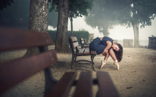 Woman park bench head down - her hand behind her head free wallpaper