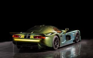 Green sports car dark room 4 - a green sports car free wallpaper