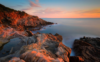 Rocky shore sunset pink sky - a rocky shore free wallpaper