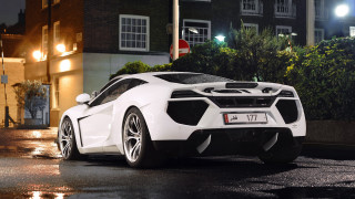 White sports car night cityscape 5 - a wet street free wallpaper