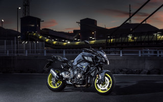 Motorcycle parking lot city night - yellow rim free wallpaper