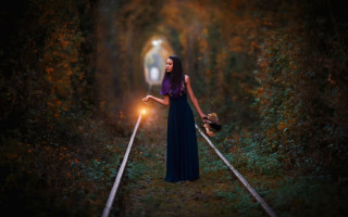 Woman holding light traintrack woods - anka zhuravleva free wallpaper