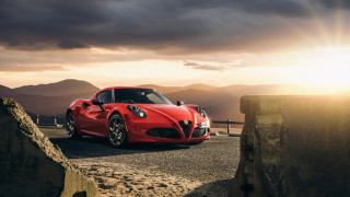 Red sports car mountain sunset 2 - a road near a mountain range free wallpaper