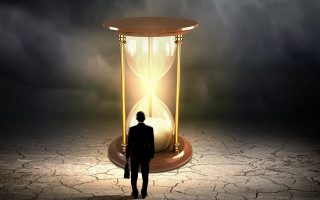 Man hourglass light shining cracked - a dark sky free wallpaper