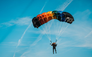 Parasailing rainbow parachute blue sky - triadic free wallpaper