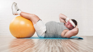 Man laying on ball bandaged - single body free wallpaper