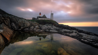 Lighthouse rocky shore cloudy sky 3 - a rocky shore free wallpaper