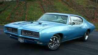 Blue muscle car green hill - a hill free wallpaper
