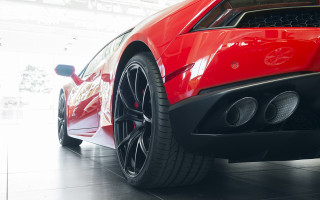 Red sports car garage black 9 - a white wall behind free wallpaper