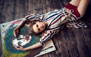 Woman paint covered on floor - paint free wallpaper