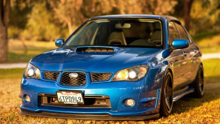 Blue car autumn leaves outdoors - a blue car free wallpaper