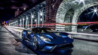 Blue sports car night cityscape - the side of a road free wallpaper